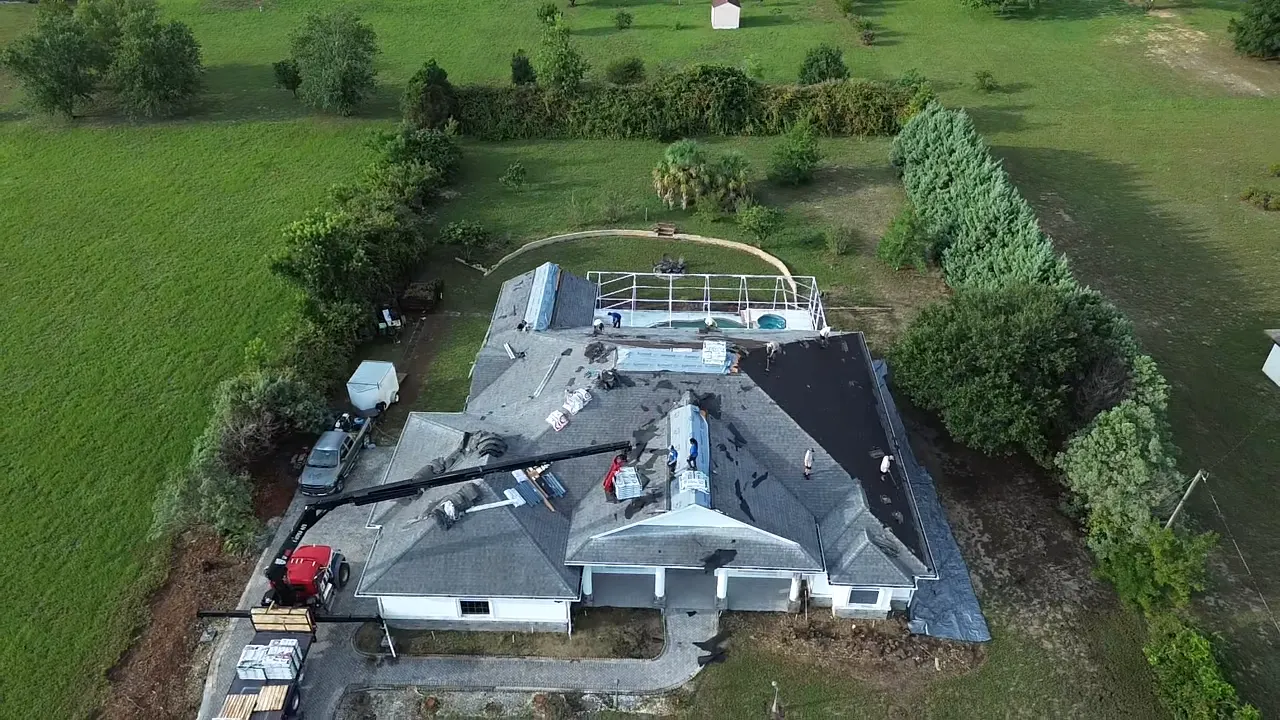 Destination Roofing crew tearing off an existing shingle roof in Beverly Hills, Florida