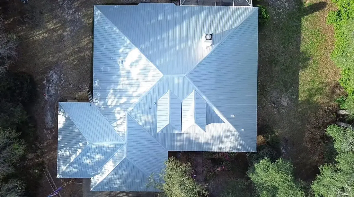 Aerial view of a completed Galvalume metal roof by Destination Roofing Inc. in Hernando, Florida