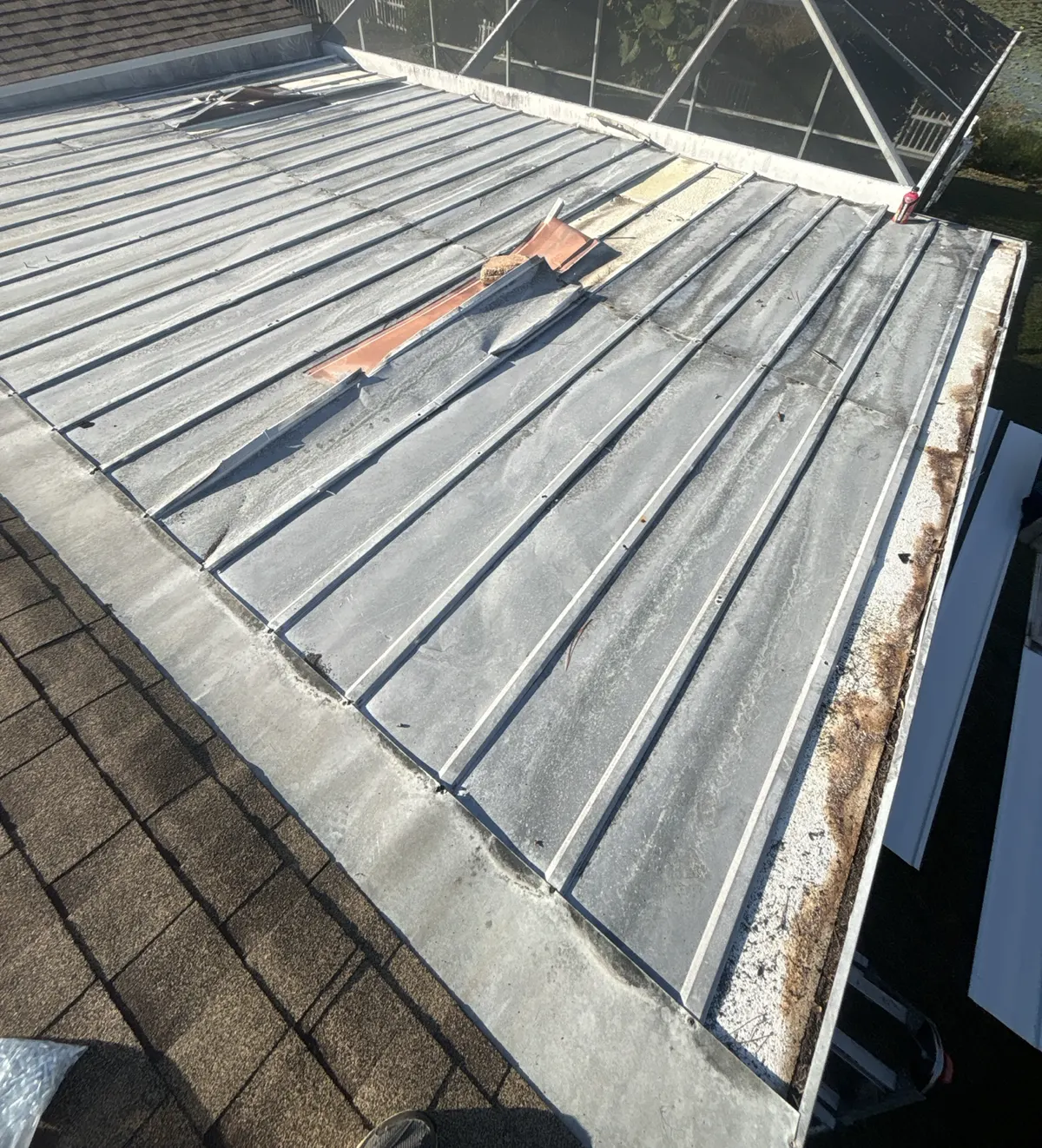 Existing deteriorated metal roof before replacement in Lecanto, Florida